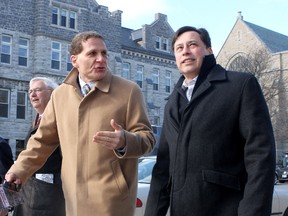 Ontario Minister of Training Colleges and Universities Brad Duguid, right, walks through the Queen's University campus in Kingston with Queen's principal Daniel Woolf, centre, and Minister of the Attorney General John Gerretsen during a visit on Tuesday April 2 2013. 
IAN MACALPINE/Kingston Whig-Standard/QMI Agency