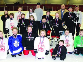 Showing off their medals at the end of the Boys and Girls Club Access Hockey program (front from left) Alex Power, Kaden Blais, Morgan Hass, Teija Ikavalko-Mullett, Zane Irving, Ryley Ikavalko-Mullett and Noah Rock. In the middle row (from left) are Dustin Lewis, Colton Lewis, Zoa Schwan, Fred Schwan, Gabe Power and Cam Schenier. In the back row (from left) Ana Black, Sam Hass, Sarah Murray-Schwan and parent coaches Jeff Power, Randy Blais and Tom Hass. Missing is head coach Derek Cook.