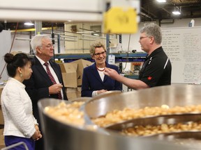 Ontario Premier Kathleen Wynne and Kingston and the Islands MPP John Gerretsen tour Transformix Engineering in Kingston Wednesday morning.
Elliot Ferguson The Whig-Standard