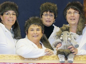 Red Lake adventures from the St. Thomas Curling Club were Gayle Yanch, left, Barbara Haskell, Brenda Cairns, Tanya Harbour holding mascot “Jumbo” who wore a matching coonskin cap. CONTRIBUTED