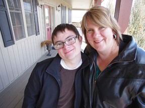 Josh Masters with his mother Michele Masters at their home north of Woodstock on April 3, 2012. HEATHER RIVERS/WOODSTOCK SENTINEL-REVIEW