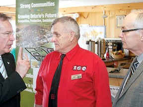 Ontario Rural Affairs Minister Jeff Leal, left, chats with 2013 International Plowing Match co-chair Bert Vorstenbosch and Perth-Wellington MPP Randy Pettapiece during an announcement of Celebrate Ontario grants Wednesday at the Perth County Welcome Centre in Shakespeare. (MIKE BEITZ The Beacon Herald)