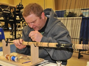 Geoff Pieroway, founder of Peiroway Rod Company Canada, threads a fishing pole during the Grande Prairie Sports Expo last year. This year's expo runs from  April 5 to 7 at the TEC Centre in Evergreen Park. (DHT file photo)