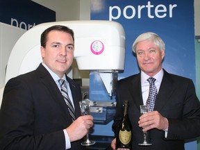 Jean-Paul Aubé, director of the Days Inn and Conference Centre, right, gets in the spirit of the upcoming Days Inn Spring Ball, raising a glass of Dom Pérignon champagne with Gianpiero Angelone, sales manager for Porter Airlines. The Days Inn is the host site of the gala event while Porter Airlines is the patron sponsor.