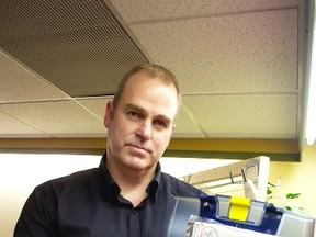 Doug Kit, safety sales specialist with Acklands Grainger, holds an AED.