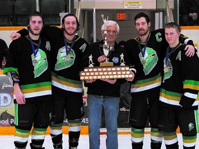 The captains of the Sherwood Park Junior B Knights hockey team receive their Capital Junior Hockey League trophy last Sunday at the Arena from league president Jim McAuley. The Knights will try to add a provincial title this weekend. Photo Courtesy Target Photography