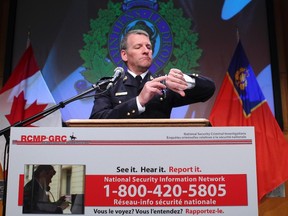 RCMP Superintendent Marc Richer, Director General RCMP Communication Services checks the time prior to speaking to the media at RCMP HQ in  Ottawa Thursday. Andre Forget/QMI Agency