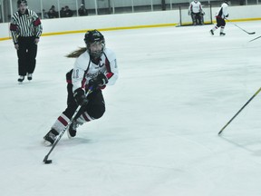 Caps captain Courtlyn Oswald carries the puck during a game earlier this year (Kevin Hirschfield/THE GRAPHIC/QMI AGENCY)