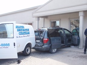 A freak accident Thursday, April 4, 2013, sent a late model van into one of the front windows of Bibles for Missions building on Wellington Street East in Chatham, On. The female driver of a panel work truck rammed the rear of the parked van knocking into the building. (BOB BOUGHNER, Chatham Daily News)