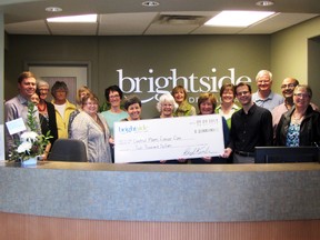 Staff of Brightside Dental Care pose with partners in the Central Plains Challenge Walk and Run during the kick off event, Thursday. Brightside donated $2,000 to the event as part of the launch. (ROBIN DUDGEON/THE GRAPHIC/QMI AGENCY)