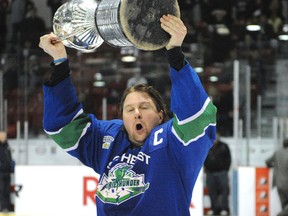 Southeast Prairie Thunder captain Ryan Smith hoists the Allan Cup after the team's 4–1 victory over the Rosetown Red Wings in Lloydminster last year.