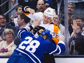 Ex-Leaf Jay Rosehill dukes it out with Colton Orr last night at the ACC. (Reuters)