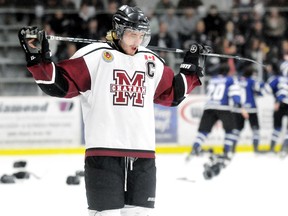 Captain Sean Myers reacts to the Chatham Maroons' season-ending loss Thursday while the London Nationals celebrate their GOJHL Western Conference championship at Memorial Arena. (MARK MALONE/The Daily News)
