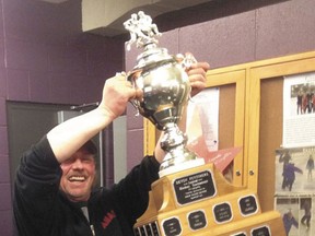 Devon’s Mike Nash hoists the Funtimers Championship trophy.