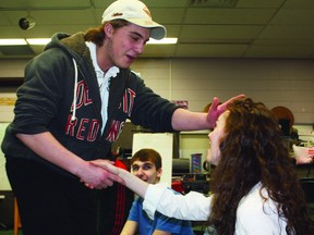 O'Gorman High School is taking on its most ambitious theatrical performance yet as the school's drama class gets ready to stage Jesus Christ Superstar from May 1-4. During rehearsal on Thursday, Garrett Barbuto, who plays Jesus, greets one of the title characters' loyal followers, played by Julie David.