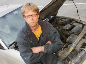 Auto mechanic Randy Smeltzer is upset about an increased certification fee that he and other skilled tradespeople will have to pay to work in Ontario. 
Elliot Ferguson The Whig-Standard