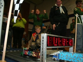 Cubs, scouts and leaders gather at the finish line to witness the fastest times posted during the Kenora Rapid Races, at Beaver Brae high school gymnasium Saturday, April 6.