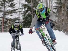 Scott Druin (front) and Ben harder go head-to-head. The fifth annual Nitehawk Mountain Bike Snowcross, presented by Redbeard Cycle repair, went Saturday, April 6, 2013 at Nitehawk Recreation Area ski hill.TERRY FARRELL/DAILY HERALD-TRIBUNE/QMI AGENCY