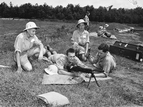 Cadets Douglas Boylan, Ray Schell, Jack Banks and Calvin Weaver are shown with a machine gun during training in July, 1952 at the former Camp Ipperwash in this Observer photo, now part of the collection at the Lambton Room.  The Kettle and Stony Point First Nation and Ottawa concluded their negotiations in March 2012 with a final settlement agreement resolving all outstanding issues regarding the former Camp Ipperwash lands. The deal is awaiting a ratification vote. OBSERVER FILE PHOTO/ QMI AGENCY