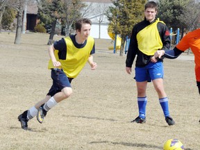 DANIEL R. PEARCE Simcoe Reformer
Austin Logan, left, chases after a ball, during a practice of the Simcoe Crew 
at Lynndale Heights Park on Sunday.