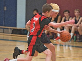 Matt Minutillo (right) hustles up court with the ball with a Niagara Falls Red Raiders defender staying close during a Major Midget game Saturday afternoonat Assumption College in the 2013 Paul Mitchell Basketball Tournament. (BRIAN THOMPSON The Expositor)