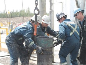 Workers operate an oil rig at the Cenovus Christina Lake oilsands facility near Lac La Biche, Alta.  VINCENT MCDERMOTT/TODAY STAFF