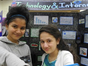 CHERYL BRINK staff photo
Nawal Haque and Anna Efthimiou, Grade 6 students at Gladstone Public School, show off their project on the internet, which was on display at the counties science fair on Saturday, April 6, 2013.