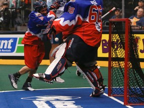 Rock goalie Nick Rose and Sandy Chapman and goalie Nick Rose of the Rock thwart Dan Dawson in close during Sunday’s game at the Air Canada Centre. (DAVE THOMAS/TORONTO SUN)