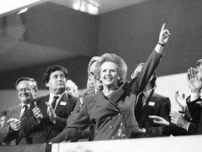 Then British Prime Minister Margaret Thatcher points skyward as she receives standing ovation at Conservative Party Conference in this October 13, 1989 file photo. Thatcher has died following a stroke, a spokesman for the family said. REUTERS/Stringer/Files