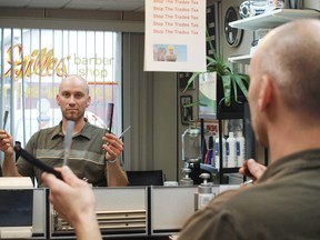 Chris Bourgon, a third generation barber refuses to pay Ontario's new College of Trades fee for mandatory trades like hairstyling. File photo