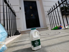 A carton of milk is seen after it was placed outside the home of former British prime minister Margaret Thatcher after her death was announced in London April 8, 2013. Margaret Thatcher, the "Iron Lady" who dominated British politics for two decades, died on Monday following a stroke, a spokesman for her family said. She was 87. Thatcher was dubbed as 'Thatcher Milk Snatcher' in the early 1970s when, as Secretary of State for Education, she proposed the withdrawal of free school milk for some school pupils.  REUTERS/Suzanne Plunkett