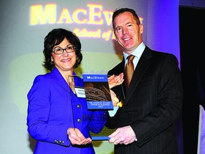 Dale Wishewan, Booster Juice President and CEO (right) accepts the Dr Charles Allard Chair from Elsie Elford, Dean of the MacEwan University School of Business. Photo Supplied