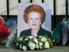 A portrait left by mourners is seen outside the home of former British prime minister Margaret Thatcher after her death was announced in London April 8, 2013.
(REUTERS/Suzanne Plunkett)