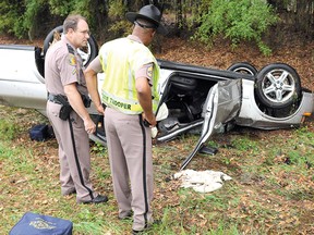 State Troopers are shown on the scene of a single-car crash on southbound Interstate 75 near Gainesville, Fla., last Wednesday that claimed the life of Stratford resident Edward Hodgins. (BRETT LE BLANC, The Gainesville Sun)