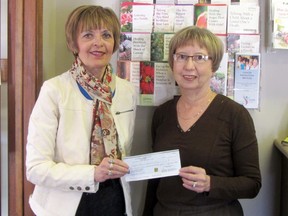 Daisy Dowhy of Central Plains Cancer Care Services accepts a cheque for $15,095 from Heather Graham of the La Prairie Lioness Club, Monday. The funds were raised from the 14th annual celebrity auction held on March 24 at the Royal Canadian Legion. Organizers would like to thank the local celebrities and businesses for the support in making the event such a success. (ROBIN DUDGEON/THE GRAPHIC/QMI AGENCY)