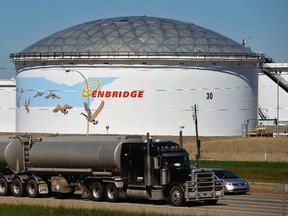 A storage tank looms over a freeway at the Enbridge Edmonton terminal in Edmonton in this 2012 file photo. Dan Riedlhuber/Reuters