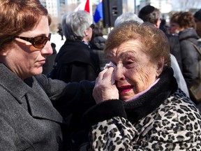 Holocaust survivor Anna Shapiro (right) is comforted by friend Kathleen Finlan after the Yom Hashoah 2013 Community Remembrance service  at the Alberta Legislature on Monday. (IAN KUCERAK/Edmonton Sun)