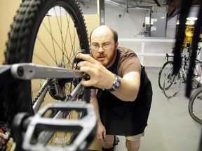 Matty Levins works on some bikes on Monday at his new shop Redbeard Cycle Repair on 109 Street in Grande Prairie. (Patrick Callan/Daily Herald-Tribune)