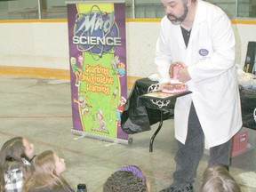 Rob Tymec of Mad Science shows students from Victor Lauriston Public School how teeth can be damaged by smoking.