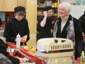 Education Minister Liz Sandals observes culinary arts students hard at work at Timmins High & Secondary School on Tuesday morning. Sandals was toured Timmins High and also had discussions with representatives from local school boards.