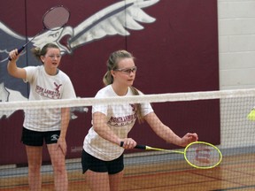 Mia Van Bree, right, of NLSS serves while partner Sarah O'Hagan during a junior badminton tournament at North Lambton Secondary School in Forest, Ont. Tuesday, April 9, 2013. PAUL OWEN/THE OBSERVER