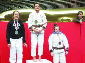 Natasha Burton of the Portage Judo Club, left, with her silver medal won at the Edmonton International Judo Tournament on April 7. (Brian Case/Submitted photo)
