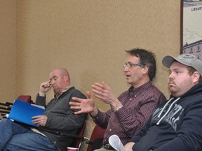 Tait's Bakery owner Perry Wenham, right, and former part-owner Stephen Mazurek, centre, are seen with Dan Thompson, left, of the Keystorm Pub during a city council committee meeting in this 2013 file photo. (FILE PHOTO)
