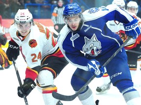 Belleville Bulls Garrett Hooey and Sudbury Wolves Nicholas Baptiste fight for position during first period OHL palyoff action from the Sudbury Community Arena on Tuesday night.

GINO DONATO/THE SUDBURY STAR