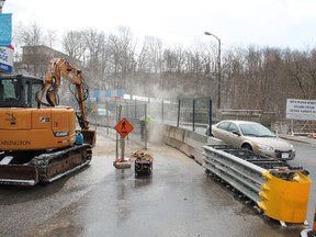 Last week crews began the summer-long project to rehabilitate the Nith River bridge in Paris at the south end of Grand River Street. Crews are scheduled to work on the bridge through the spring and summer for a fall completion. Two-way traffic will be maintained throughout the project with a few short closures. MICHAEL PEELING/The Paris Star