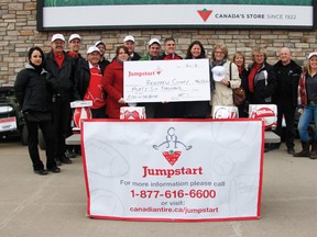 MYRIAM LUBLINK     Canadian Tire Jumpstart presented a cheque for $46,000 to the Renfrew County Jumpstart Chapter and announced that four new partners will be joining the Chapter. Marc Wolvin, regional manager for Eastern and Northern Ontario Canadian Tire Jumpstart Charities, presented the cheque with representatives of the four new partners, surrounded by employees from the Canadian Tire in Pembroke. From left: Sylvia Weremko, employee; Rob Inglis, employee; John Birch, general manager; William Kenopic, owner of Canadian Tire Renfrew; Alan Godin, employee; Cheryl Kauffeldt, youth program coordinator; Denis Beech, owner of Canadian Tire Pembroke; Jordan Derocher, volunteer coordinator; Marc Wolvin, regional manager for Eastern and Northern Ontario Canadian Tire Jumpstart Charities; Susan Ellis, economic development manager for Pembroke; Beth McWatters, manager; Melissa Gauthier, employee; Roy LeMasurier, employee; and Shallon Dament, representative from the Boys and Girls club.