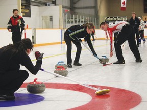 Sheena Read  Editor
Dacey Brown offers direction and encouragement to Courtney Missikewitz and Joel Berger, while Jeremy Harty watches. Team Harty won this game against Team Sjogren, and went on to win the A Event of the Nanton Curling Club’s annual Meatspiel April 7.