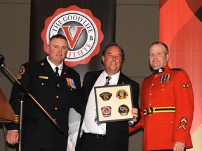 From Left: Vermilion Fire Chief Bill Roth, 9-11 survivor and former FDNY Fire Chief Richard Picciotto, and RCMP Sgt. Mike McGinley gather for a photo after presenting Picciotto with a token of appreciation for coming to Vermilion to share his story.