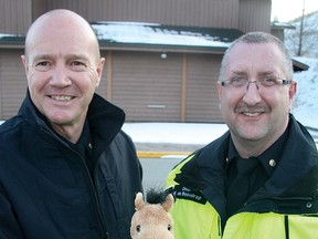 Part of the community care package is a Trauma Ted, or in the case of Cochrane, a Trauma Horse, for youngsters, shown here by Gary Burnett, left, and Mac deBeaudrap.