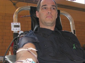 Rob Brown, a firefighter with the Chatham-Kent Fire Service, was among the many uniformed police, fire or emergency personnel who gave blood Wednesday at a donor clinic at St. Joseph's Parish Centre in Chatham. Brown is a regular blood donor.